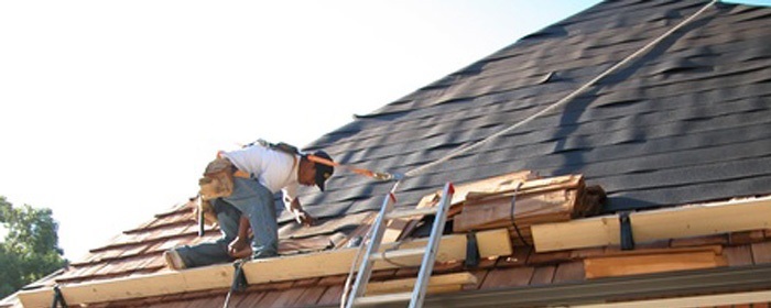 man fixing roof